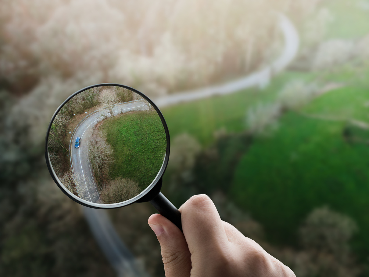 Magnifying glass focusing on a road